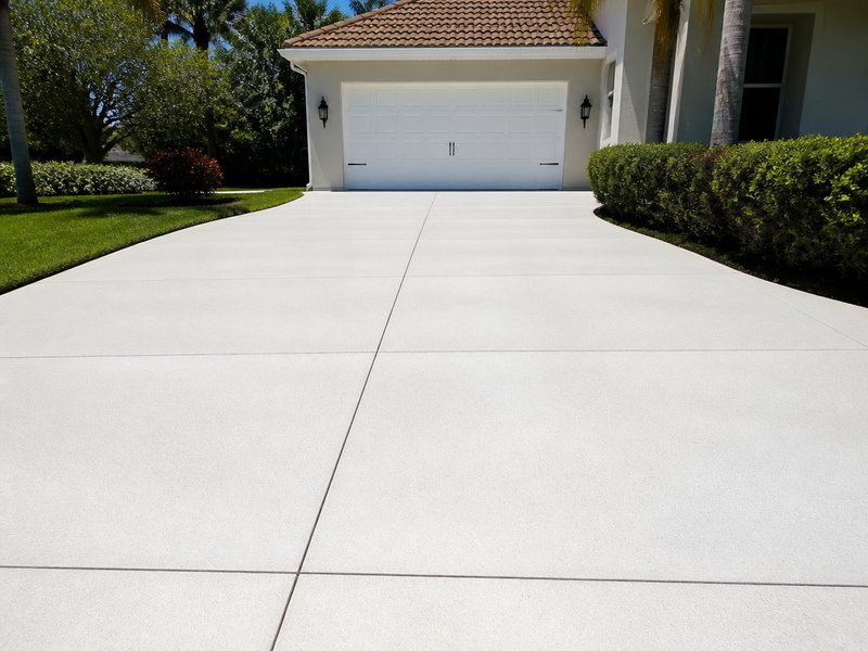 Tarpon Springs, FL driveway pressure washing after Sandbar Soft Wash - Oil treatment and full flush restored the approach