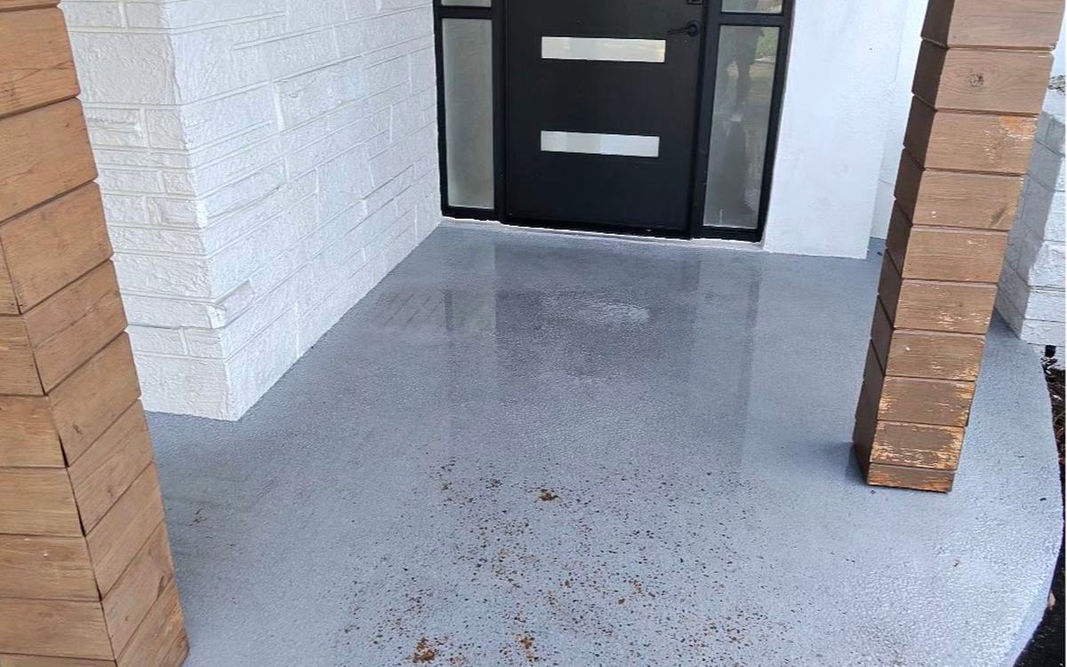 Front entry porch with rust and algae stains before Sandbar cleaning — real job photo