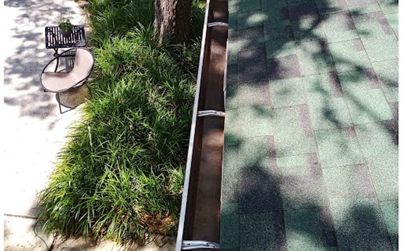 Debris-free aluminum gutter beside a green shingle roof after a Sandbar gutter cleaning — real job photo