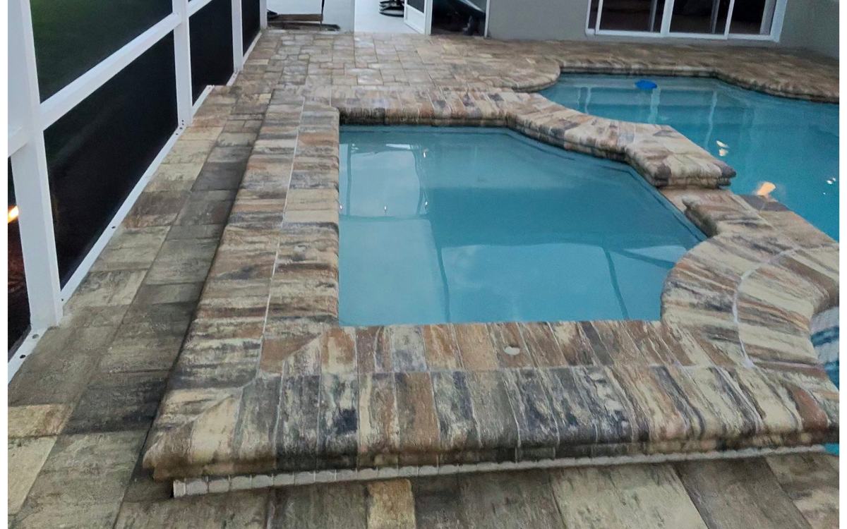 The same paver pool deck with color restored after Sandbar cleaning