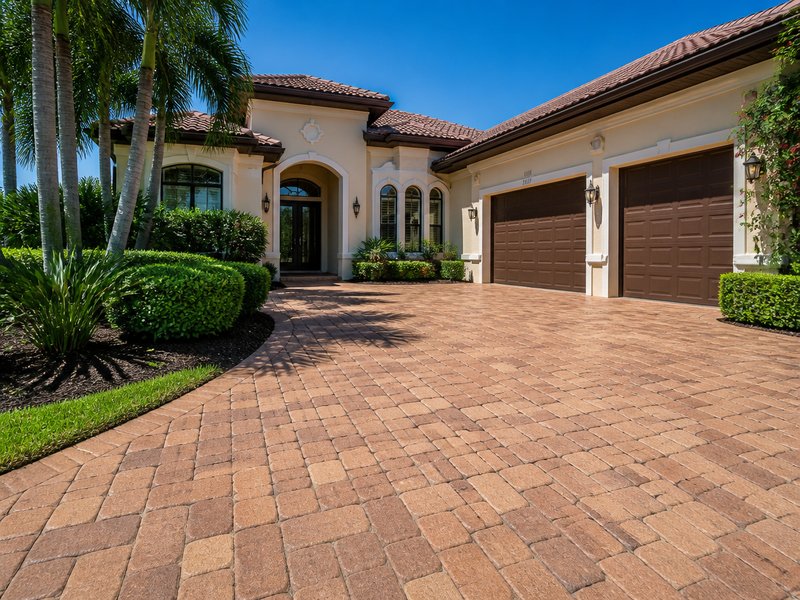 Holiday, FL paver cleaning & sealing after Sandbar Soft Wash - Faded brick color restored and sealed against UV